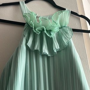 It has some stains that can be removed at the dry cleaners.